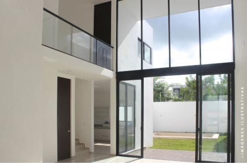 1020-47679-Residencias-en-Privada-en-Cholul-con-diseno-de-sala-y-comedor-a-doble-altura_(3).jpg